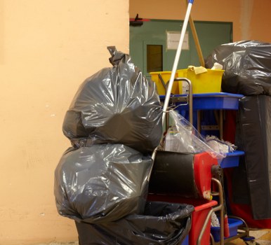 Construction site with organized waste clearance in Queens Park