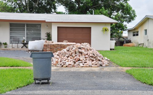 Loading waste into a skip for hire