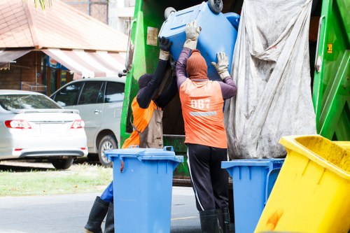 Workers sorting construction waste for recycling